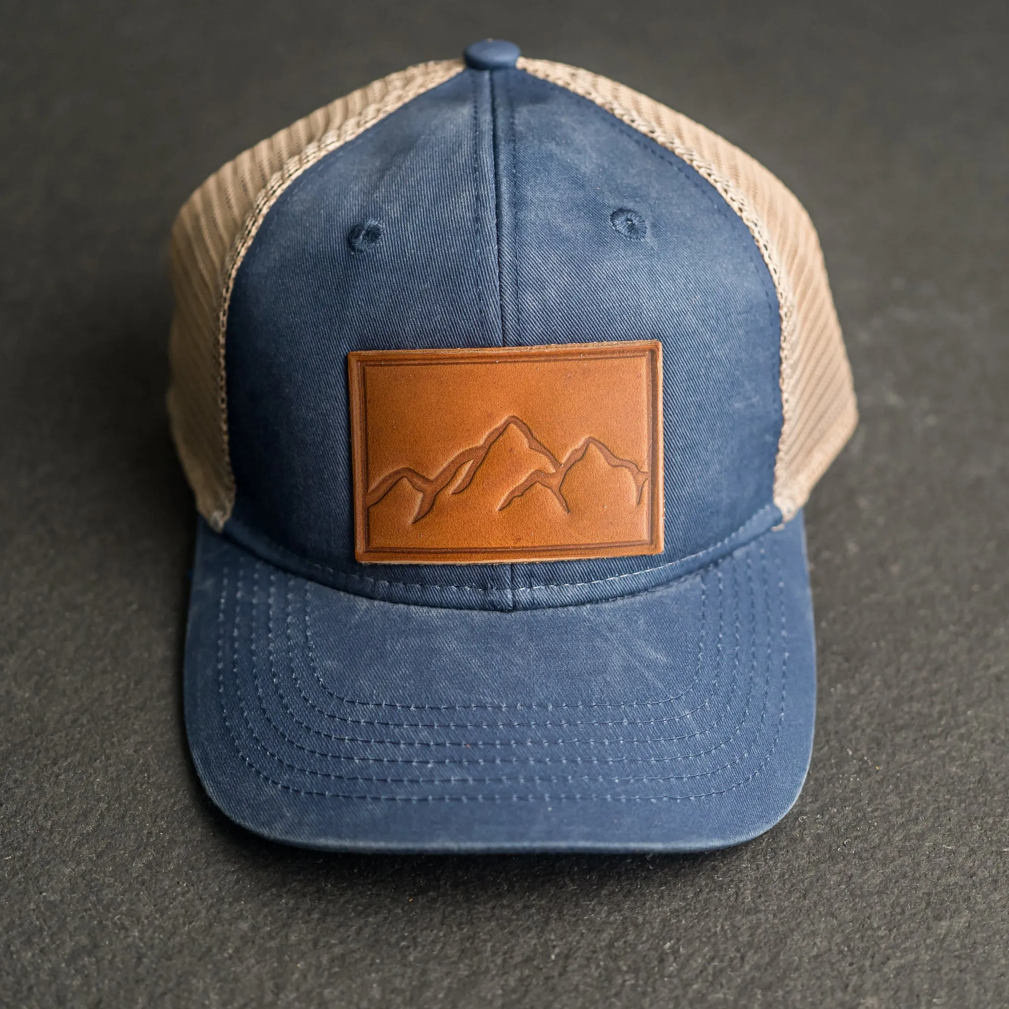 Leather Patch Ponytail Style Hat - Mountain Range Stamp