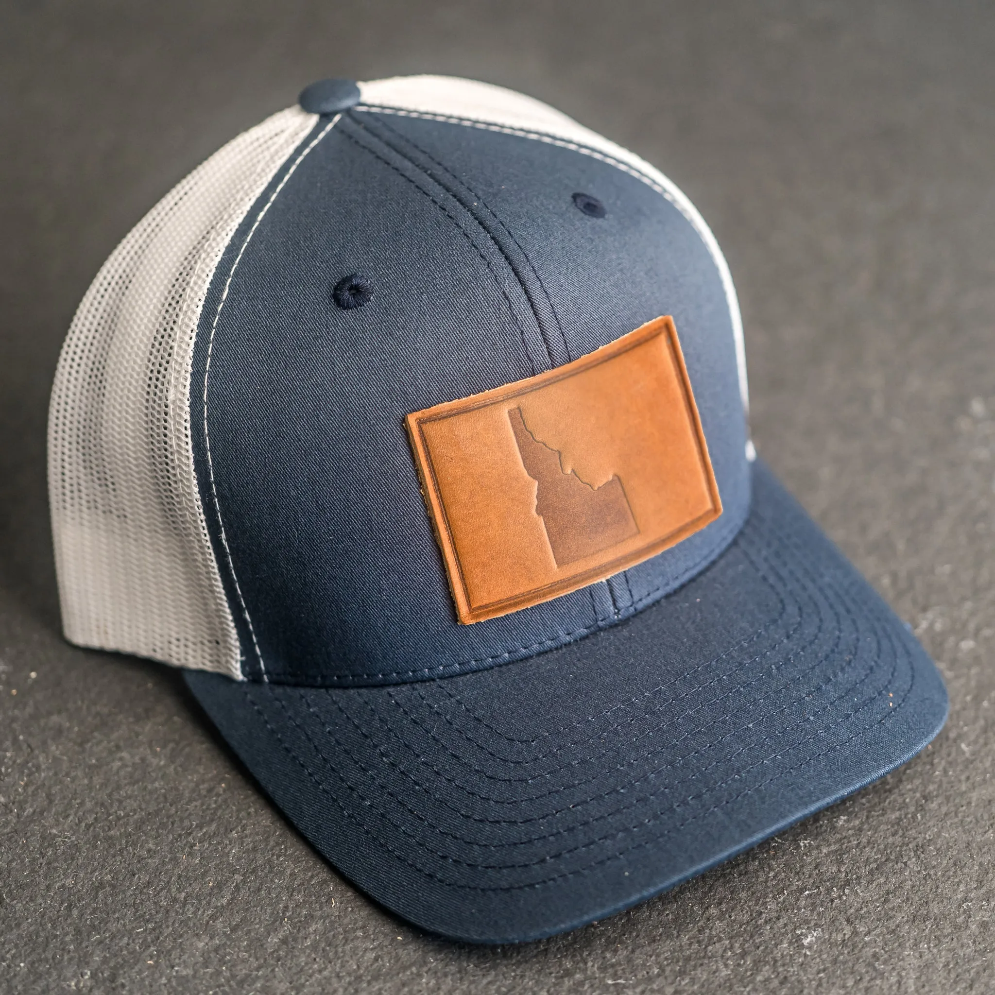 Leather Patch Trucker Style Hat - Idaho Stamp