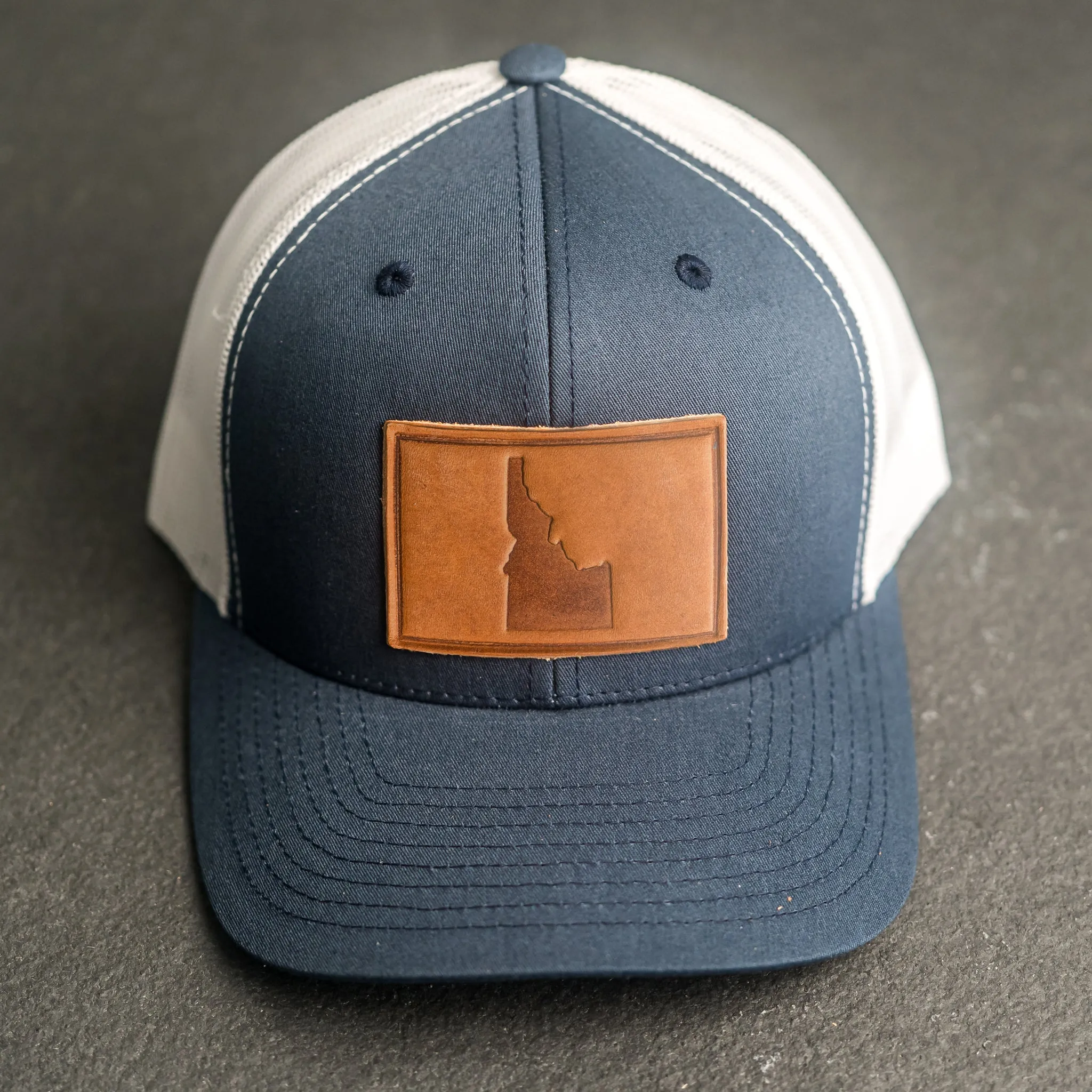Leather Patch Trucker Style Hat - Idaho Stamp